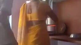 Sly hubby fucks and records Indian wife in the kitchen 